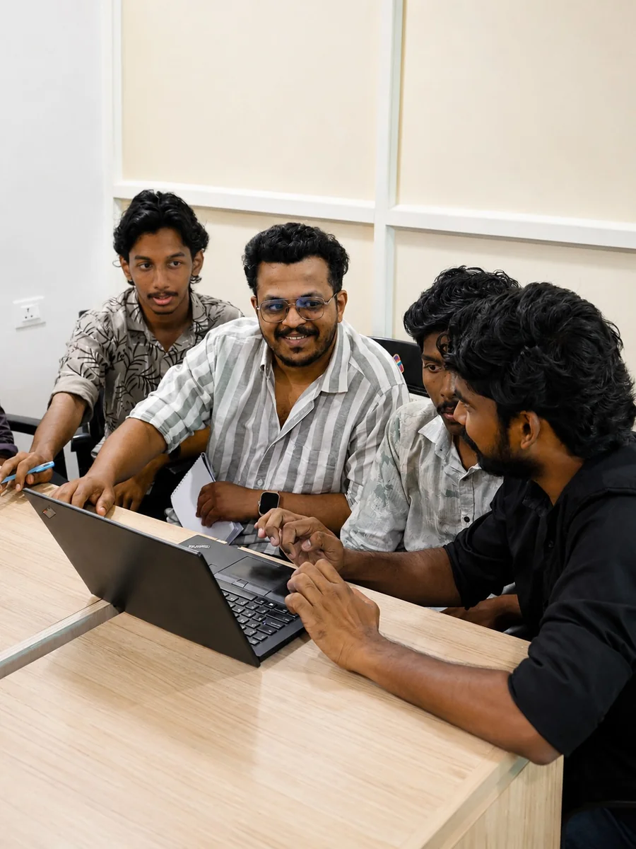 Attendees working through a live demo on a laptop