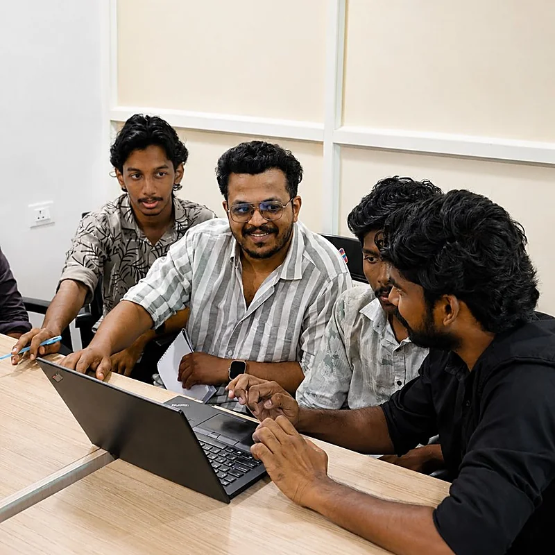 Friends exploring a course together at a laptop