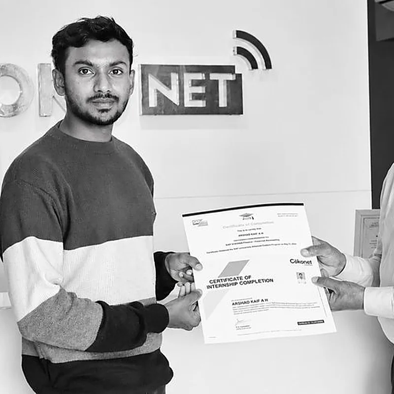 A learner receiving his certificate at Cokonet